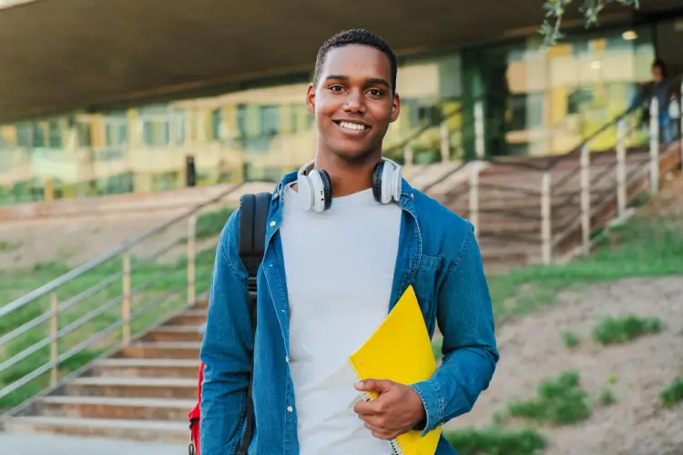 Male-Student-Headphones-Yellow-Folder.jpg