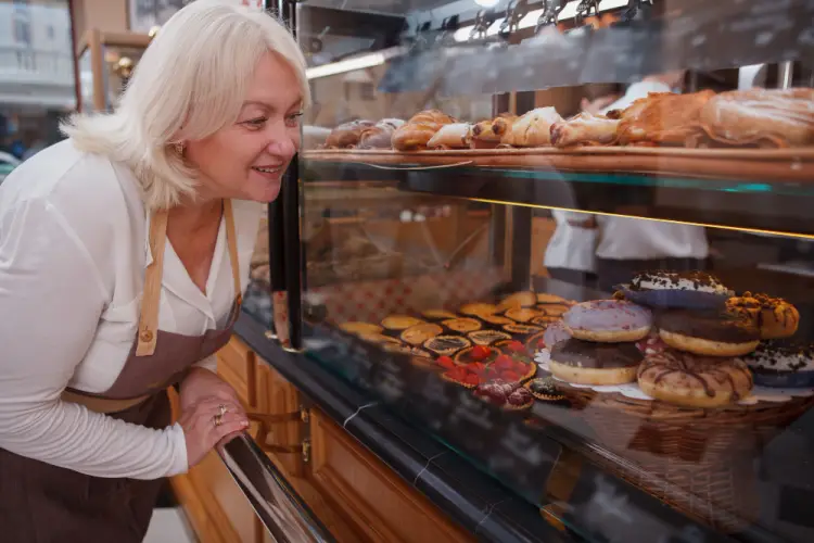 bakery-staff-showcasing-fresh-donuts-and-pastries.jpg