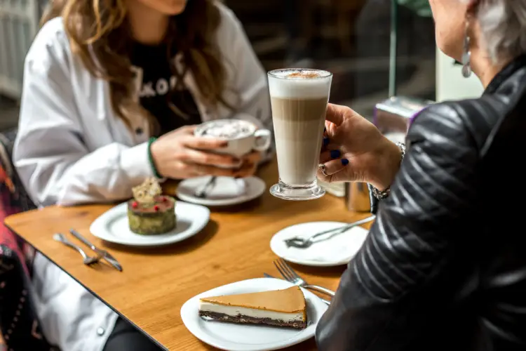 friends-enjoying-coffee-desserts-cafe.jpg
