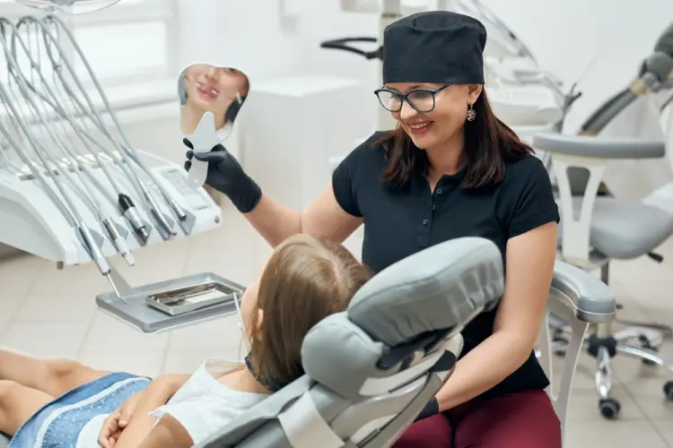 girl-checking-teeth-dentist.jpg