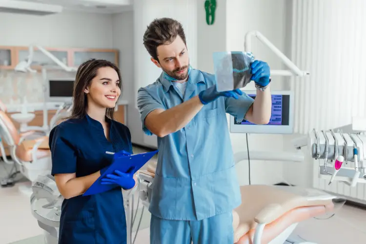 dental-assistant-helping-dentist.jpg