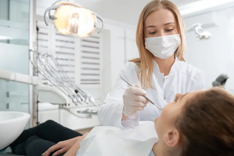 female-dentist-checking-patient.jpg