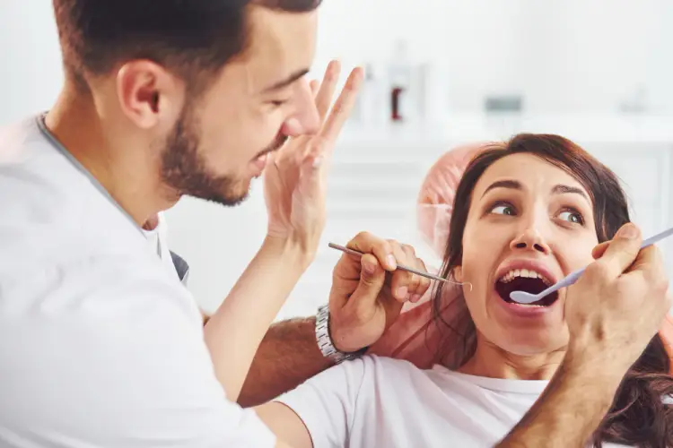 dentist-checking-female-patient-teeth.jpg