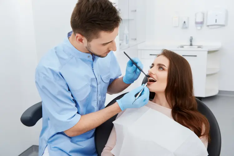 female-patient-smiling-dental-visit.jpg