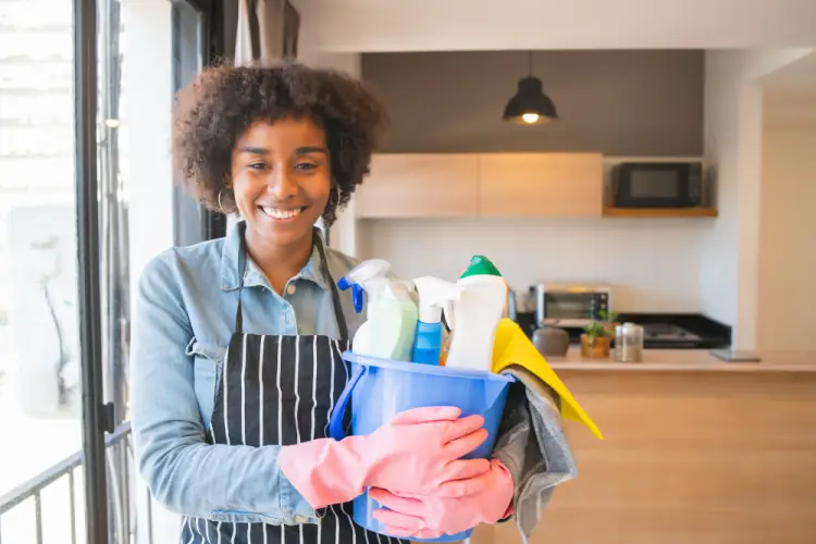 happy-cleaning-lady-holding-bucket-supplies.jpg