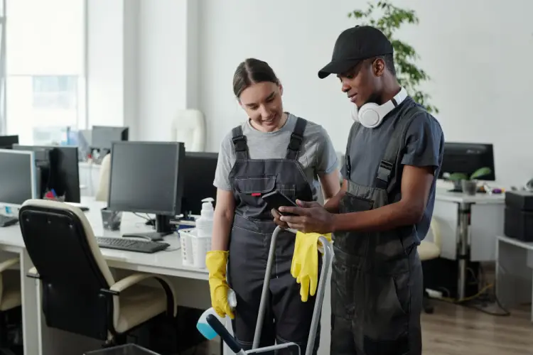 cleaning-team-reviewing-phone-office.jpg