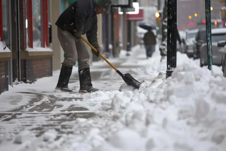manual-sidewalk-snow-shoveling-downtown-commercial.jpg