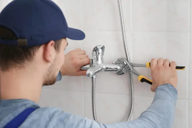 plumber-fixing-faucet-bathroom_392895-213444.jpg