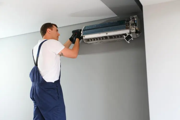 technician-repairing-air-conditioner-wall_255667-55469.jpg