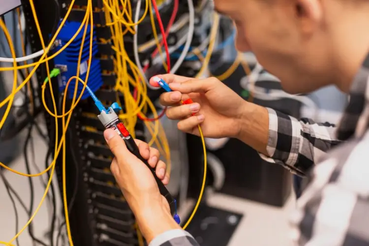 engineer-man-verifying-optical-fiber_23-2148323461.jpg