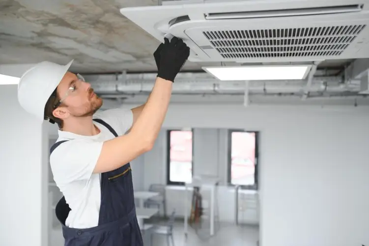 happy-male-technician-repairing-air-conditioner_255667-56570.jpg