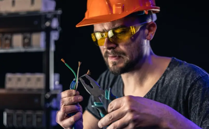 male-electrician-works-switchboard-with-electrical-connecting-cable_169016-18026.jpg