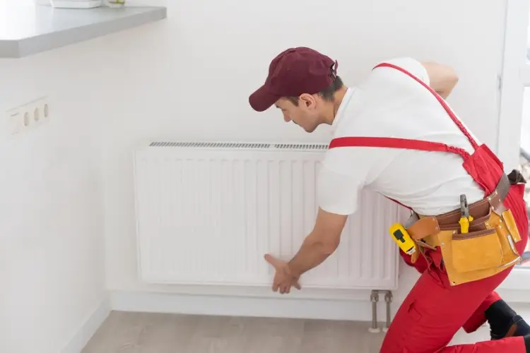 plumber-man-is-blocking-repairs-radiators-heating-battery-apartment-tap_493343-14465.jpg