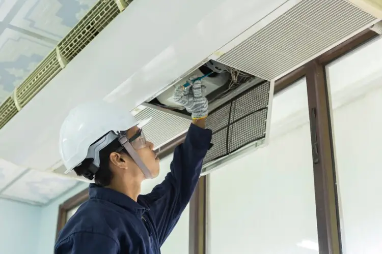 air-conditioner-cleaning-man-gloves-checks-filter-young-man-adjusting-air-conditioning-system_39733-466.jpg