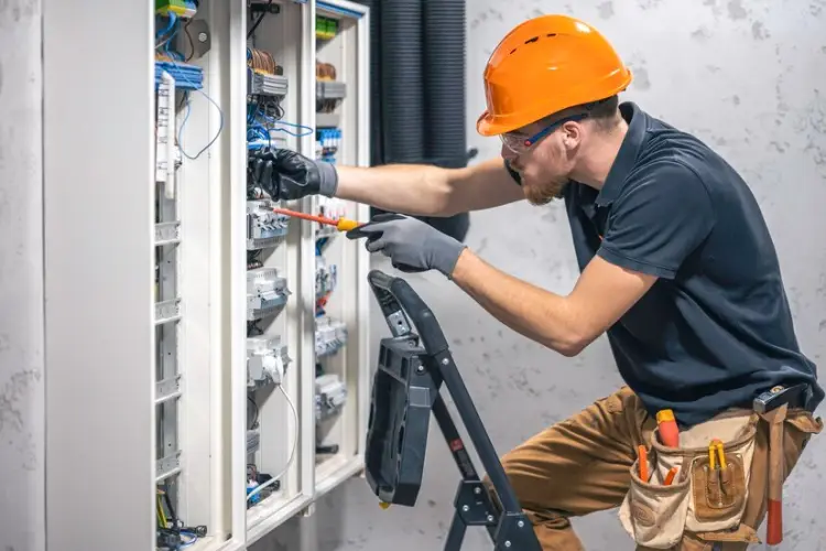 young-adult-electrician-civil-engineer-screwing-equipment-into-fuse-box_169016-53047.jpg