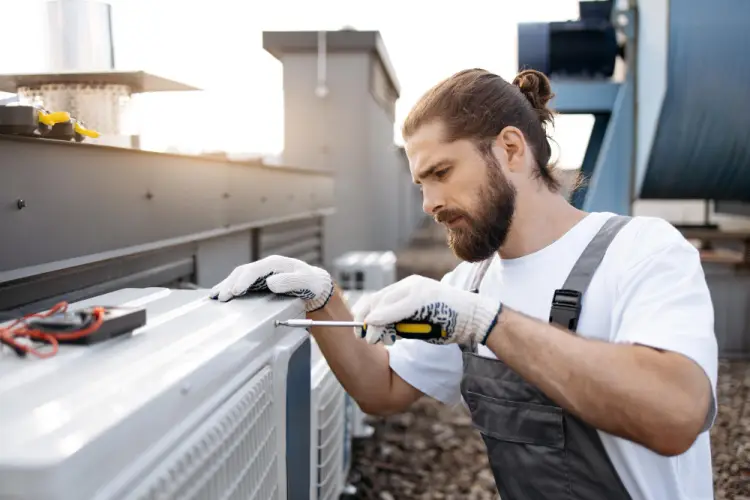 hvac-technician-fixing-commercial-ac.jpg