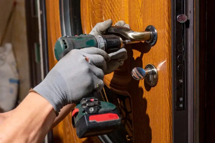 locksmith-installing-door-handle-with-drill.jpg
