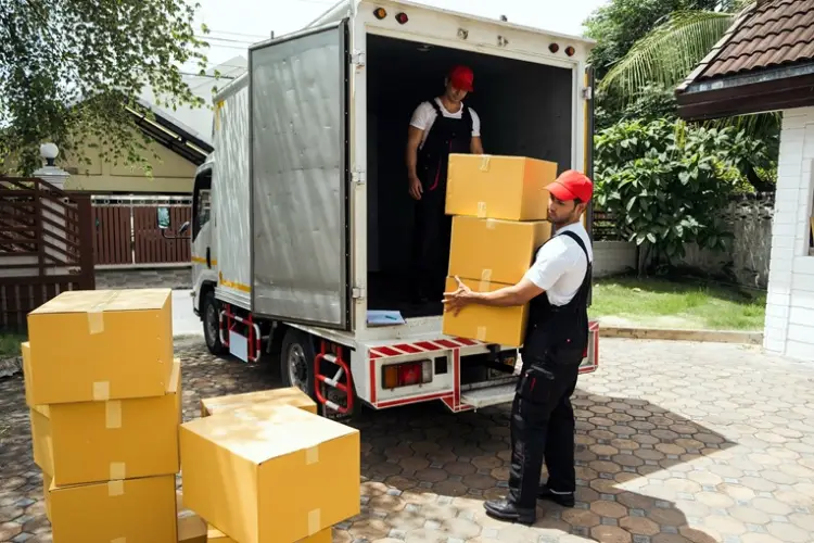 movers-in-uniform-unloading-yellow-boxes-from-truck.jpg
