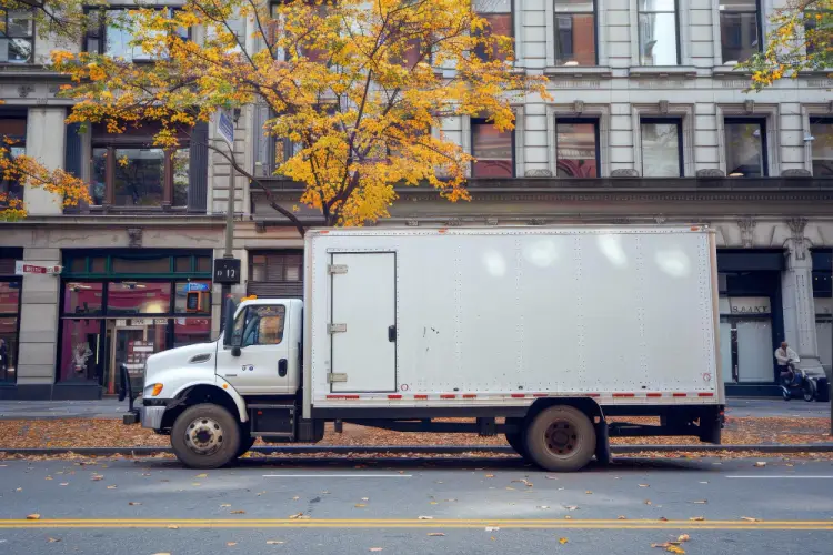 white-moving-truck-parked-on-urban-street.jpg