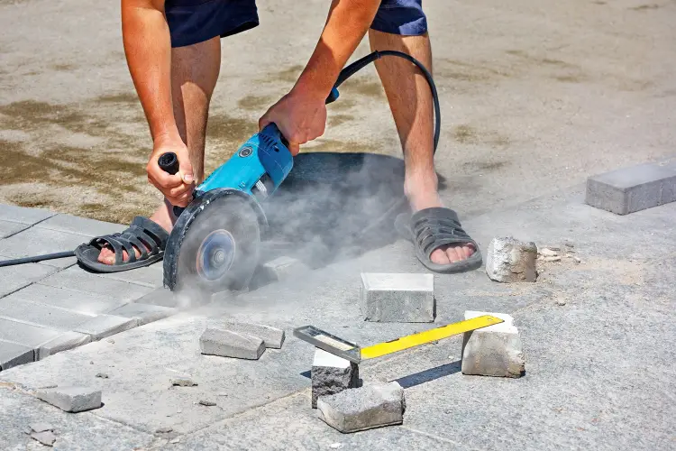cutting-paving-slabs-with-angle-grinder-on-driveway.jpg