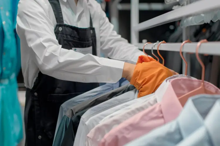closeup-hands-sorting-colorful-dress-shirts.jpg