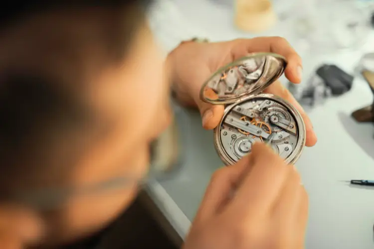 watchmaker-repairing-vintage-pocketwatch-gears.jpg