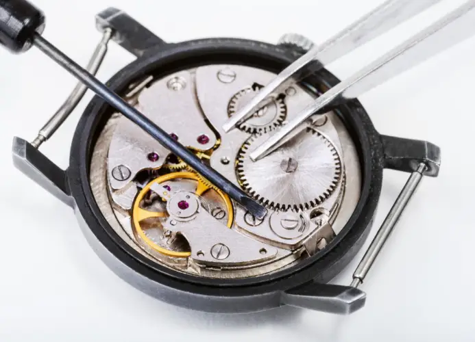 watch-movement-repair-gears-and-tweezers.jpg