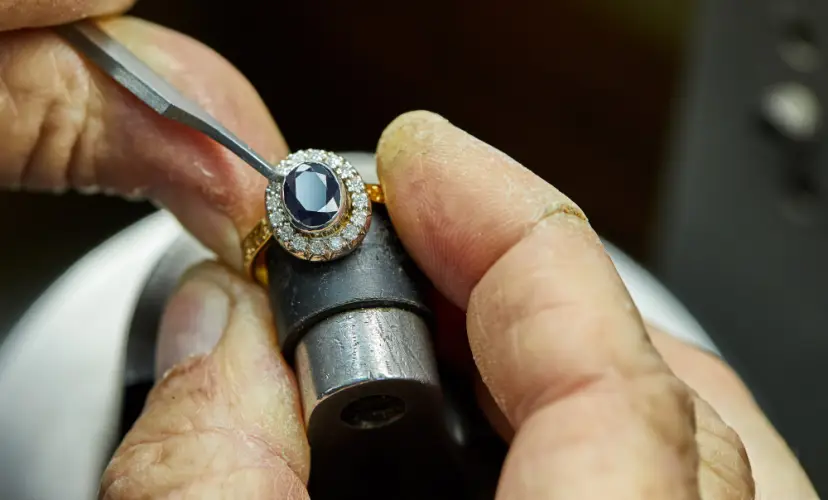jeweler-setting-sapphire-ring-diamond-halo.jpg