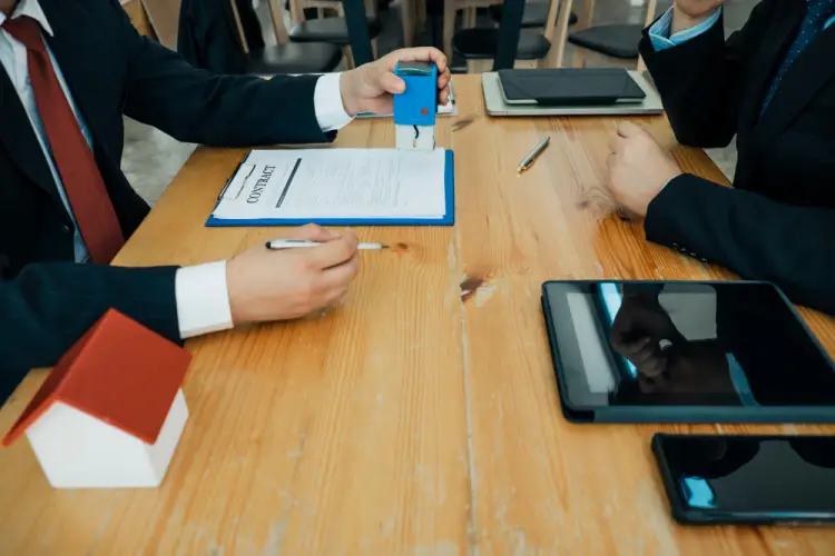 contract-stamping-meeting-between-partners.jpg