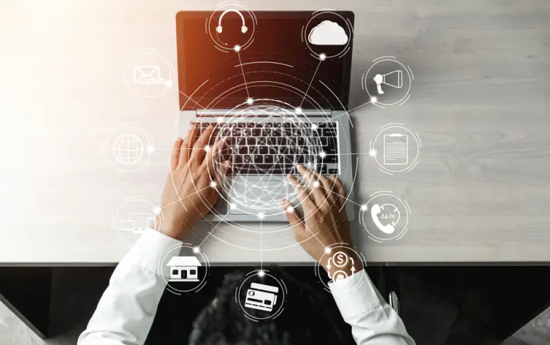 hands-typing-on-laptop-with-digital-interface-icons.jpg