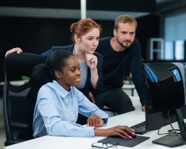 three-coworkers-collaborating-on-computer-project.jpg