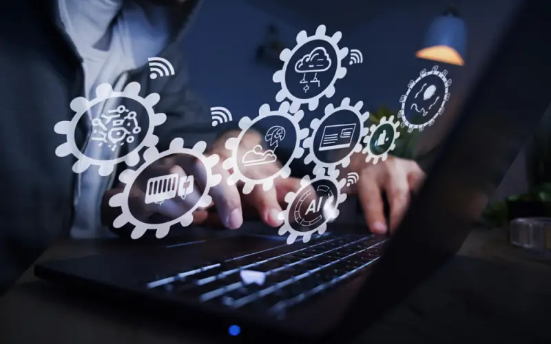 person-using-laptop-with-ai-and-tech-icons.jpg