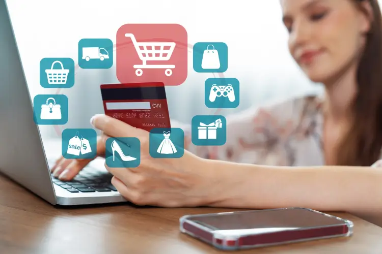 consumer-holding-credit-card-typing-phone-shopping-online-inventory-cybercash.jpg