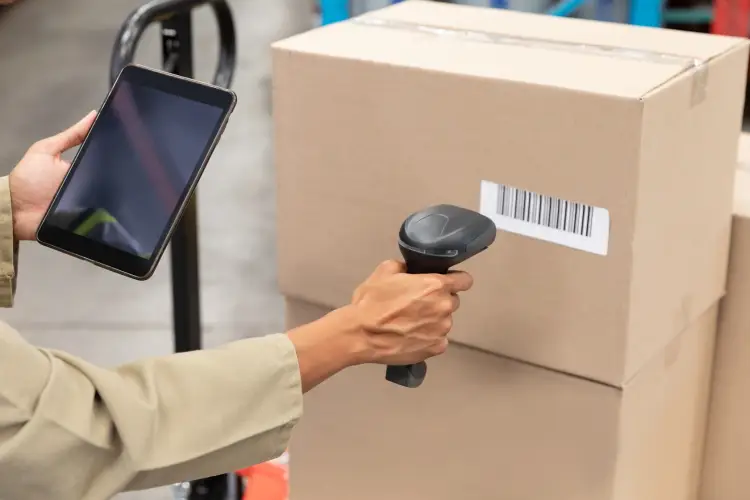 female-worker-scanning-package-with-barcode-scanner-while-using-digital-tablet-warehouse.jpg