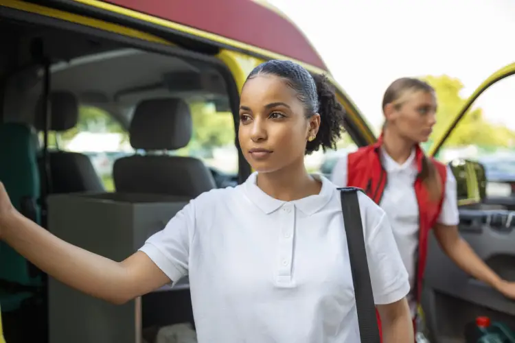 paramedic-nurse-emergency-doctor-ambulance-with-kit-paramedic-standing-rear-ambulance-by-open-doors.jpg