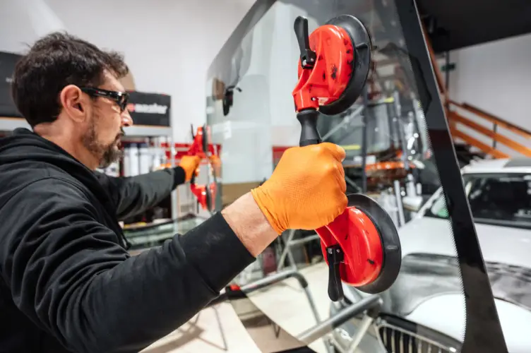 auto-glass-technician-using-suction-cups.jpg