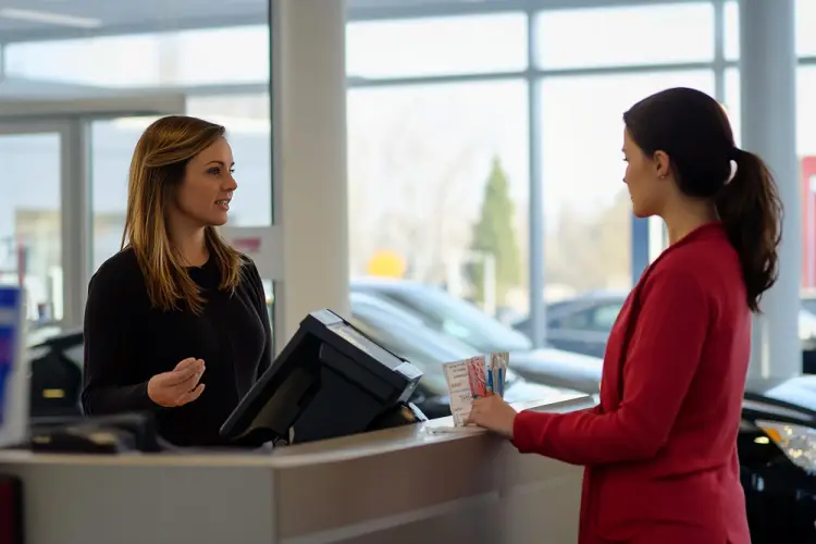 woman-consulting-dealership-representative.jpg