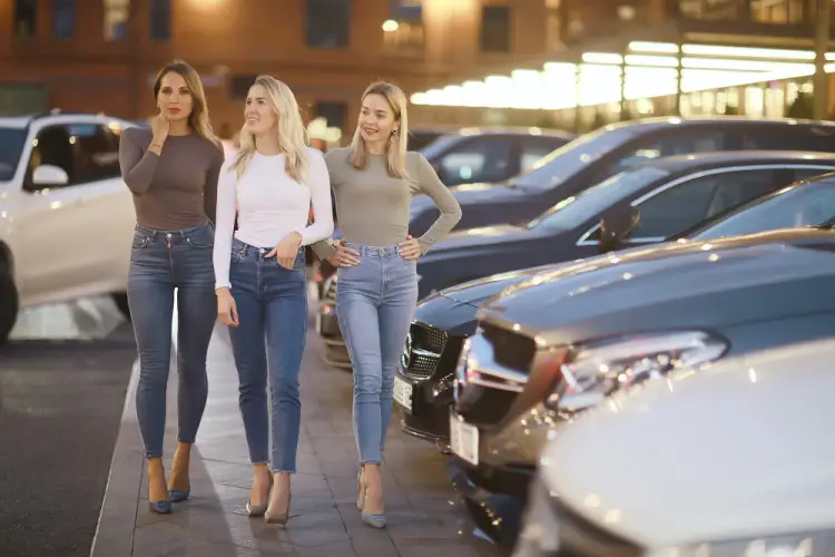 three-women-walking-car-dealership.jpg