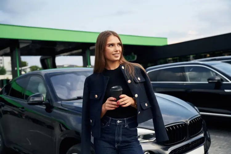 stylish-woman-standing-by-luxury-car.jpg