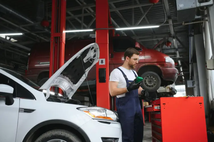 mechanic-in-garage-preparing-tools-car-maintenance.jpg