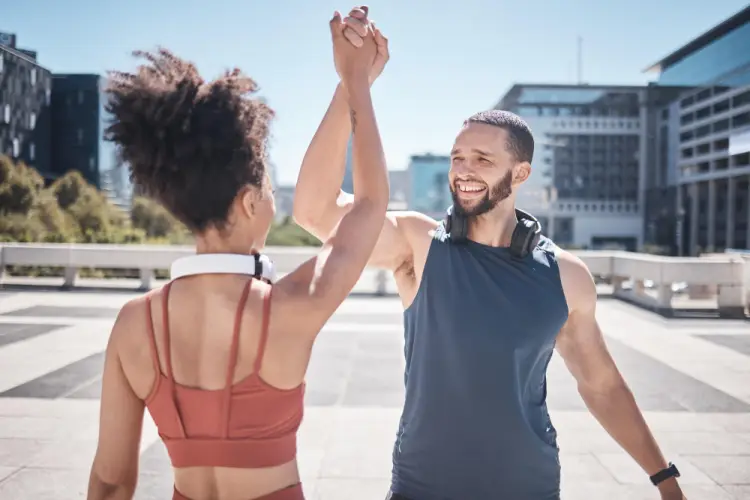 fitness-couple-high-five-cityscape.jpg