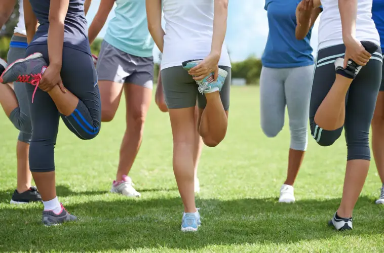 team-stretching-on-field-preworkout.jpg
