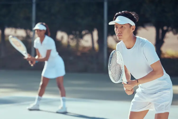 mixed-doubles-tennis-players-focused.jpg