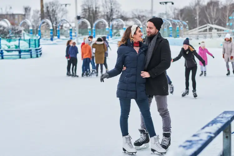 couple-ice-skating-outdoor-winter-rink.jpg