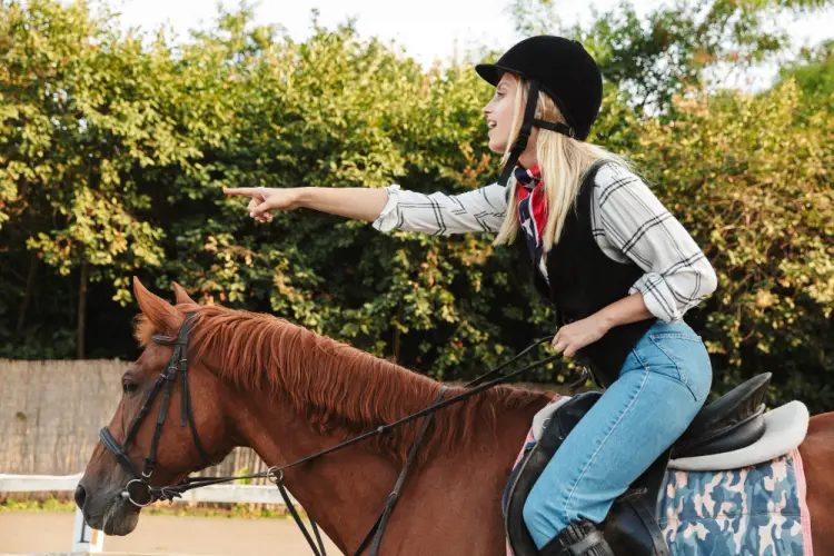 young-woman-horse-riding-pointing.jpg