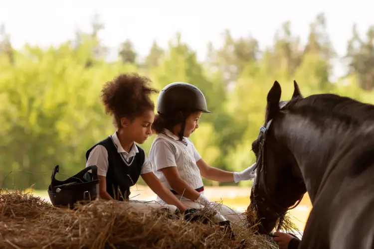two-children-petting-horse.jpg