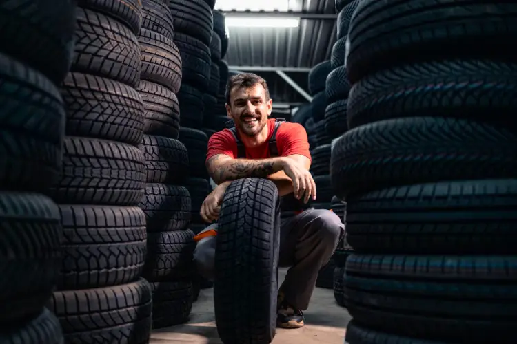 mechanic-smiling-in-tire-shop.jpg