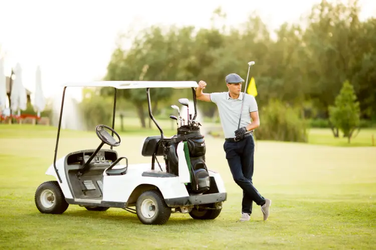 golfer-leaning-on-golf-cart.jpg