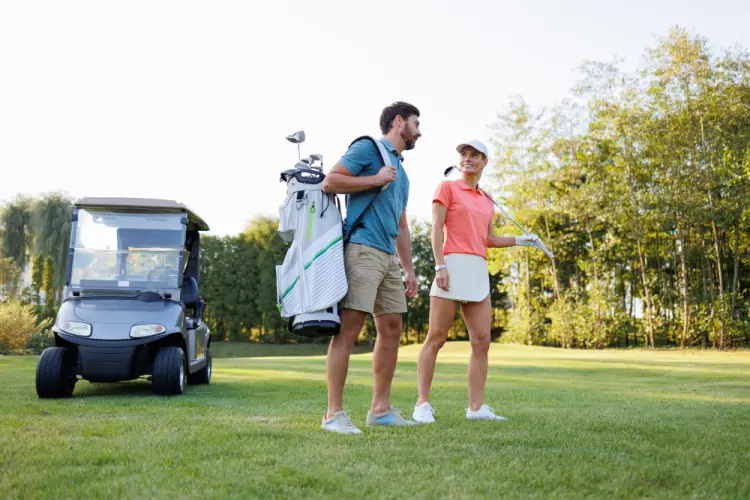 golf-couple-walking-course.jpg