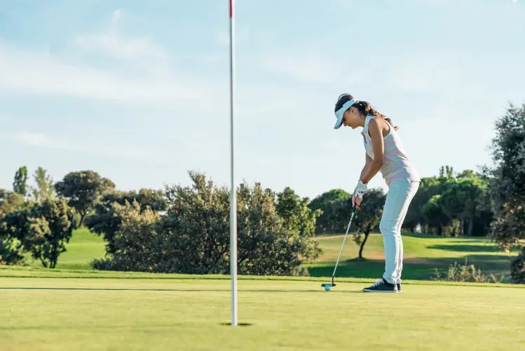 woman-putting-on-green-golf-course.jpg